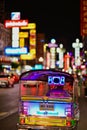 Traditional Thai Tuk-Tuk or Three-Wheeled Rickshaw Taxi on Yaowarat Road or Chinatown at Night