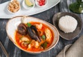 Traditional Thailand soup Tom Yam. With shrimps, mussels, scallop meat, rice and hot spices. Royalty Free Stock Photo