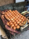 Traditional Thailand Street Food: Grilled/Roasted chicken eggs, sweet taros, mackerel fish and corn on the charcoal grill stove Royalty Free Stock Photo