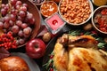 Traditional Thanksgiving day feast with delicious cooked turkey and other seasonal dishes served on table Royalty Free Stock Photo