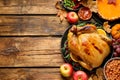 Traditional Thanksgiving day feast with delicious cooked turkey and other seasonal dishes served on wooden table, flat lay. Space Royalty Free Stock Photo