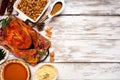 Traditional Thanksgiving turkey dinner. Top view side border on a rustic white wood background.