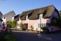 A traditional thatched roof cottage in Dunster, Minehead, Somerset UK Royalty Free Stock Photo