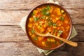 Traditional thick sweet potato soup with lentils close up in a bowl on the table. Horizontal top view Royalty Free Stock Photo