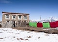 Traditional Tibetan house with drying clothes