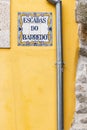 Traditional tile sign for the stairs to the Barredo district