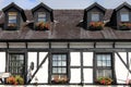 Traditional timbered house with black roof