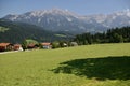 Traditional Tirolean Houses with mountains behind. Soll, Austria, August 1, 2009.