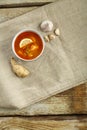 Traditional tom yam soup with chicken in a plate on a linen tablecloth on a napkin. Royalty Free Stock Photo