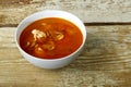 Traditional tom yam soup with chicken in a plate on a wooden table. Horizontal photo Royalty Free Stock Photo