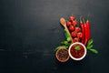 Traditional tomato ketchup sauce. Cherry tomatoes, spices, chili peppers, olive oil, parsley. Top view. Royalty Free Stock Photo