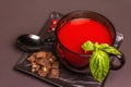 Traditional tomato soup in a cup. Basil, croutons, spices, cutlery Royalty Free Stock Photo