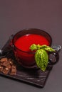 Traditional tomato soup in a cup. Basil, croutons, spices, cutlery Royalty Free Stock Photo