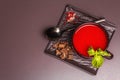 Traditional tomato soup in a cup. Basil, croutons, spices, cutlery Royalty Free Stock Photo