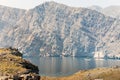 Traditional tour boat on water on cruise in persian gulf. Oman travel famous leisure activities Royalty Free Stock Photo