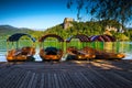 Wooden Pletna boats anchored on the lake Bled, Slovenia