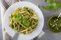 Traditional trofie pasta with pesto sauce on white plate Royalty Free Stock Photo