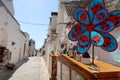 The traditional Trulli houses in the street of Alberobello city, Italy, Apulia region, Adriatic Sea with typical souvenir shop