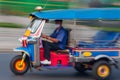 Traditional tuk-tuk from Bangkok, Thailand, in motion blur. Royalty Free Stock Photo