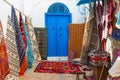 Traditional Tunesian carpets hanging on blue walls in resort town Sidi Bou Said. Tunisia, North Africa