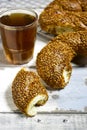 Traditional turkish breakfast with simit bagels in basket with teapot Royalty Free Stock Photo