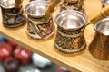 Traditional Turkish cezve - copper coffee pots on the shelf in the shop. One of the most popular souvenir from Istanbul