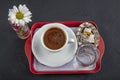 Traditional turkish coffee drink concept. Turkish coffee with glass of water and turkish delights on wooden table Royalty Free Stock Photo