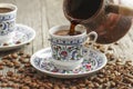 Traditional turkish coffee in porcelain cup with turkish delights Royalty Free Stock Photo