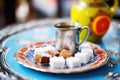 traditional turkish coffee set beside a small plate of turkish delight Royalty Free Stock Photo