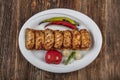 Traditional Turkish Cuisine, Grilled chicken wings baking on wooden background, top view Royalty Free Stock Photo