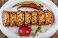 Traditional Turkish Cuisine, Grilled chicken wings baking on wooden background, top view Royalty Free Stock Photo