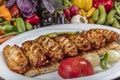 Traditional Turkish Cuisine, Grilled chicken wings baking on wooden background, top view Royalty Free Stock Photo