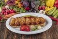 Traditional Turkish Cuisine, Grilled chicken wings baking on wooden background, top view Royalty Free Stock Photo