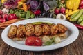 Traditional Turkish Cuisine, Grilled chicken wings baking on wooden background, top view Royalty Free Stock Photo