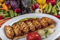 Traditional Turkish Cuisine, Grilled chicken wings baking on wooden background, top view Royalty Free Stock Photo