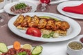 Traditional Turkish Cuisine, Grilled chicken wings baking on wooden background, top view Royalty Free Stock Photo