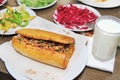 Traditional Turkish cuisine, Tantuni with loaf bread. Royalty Free Stock Photo