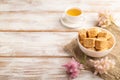 Traditional turkish delight rahat lokum with cup of green tea on a white wooden background. side view, copy space Royalty Free Stock Photo