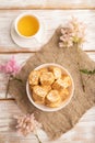 Traditional turkish delight rahat lokum with cup of green tea on a white wooden background. top view, close up Royalty Free Stock Photo