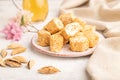 Traditional turkish delight rahat lokum with glass of green tea on a gray concrete background, side view, selective focus Royalty Free Stock Photo