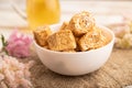 Traditional turkish delight rahat lokum with glass of green tea on a white wooden background. side view, close up Royalty Free Stock Photo