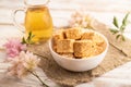 Traditional turkish delight rahat lokum with glass of green tea on a white wooden background. side view, close up Royalty Free Stock Photo