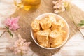 Traditional turkish delight rahat lokum with glass of green tea on a white wooden background. top view, close up Royalty Free Stock Photo