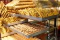 Traditional Turkish dessert Baklava close-up in the local Baklava shop, Turkey. Trays of delicious baklava displayed in showcase Royalty Free Stock Photo