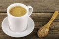 Traditional Turkish Dibek coffee in coffee cup on wooden table