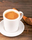 Traditional Turkish Dibek coffee in coffee cup on wooden table