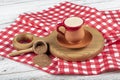 Traditional Turkish Dibek coffee in coffee cup on wooden table. Turkish dibek coffee grinded in a large stone mortar with the