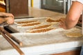 Traditional Turkish dish peed with cheese or meat. A baker of Turkish nationality rolls out the dough and puts it in the oven