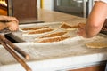 Traditional Turkish dish peed with cheese or meat. A baker of Turkish nationality rolls out the dough and puts it in the oven