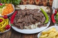 Traditional Turkish Doner Kebab, shawarma or gyros with pita and rice. Turkish, greek or middle eastern style doner kebab food on Royalty Free Stock Photo